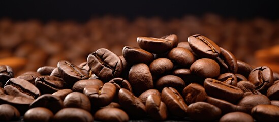 Poster - Close up heap of roasted brown coffee beans coffee beans background. copy space available