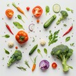 © Ashraf - Top view of fresh vegetables and herbs arranged on a light grey surface. Red chili, sliced tomatoes, garlic cloves, basil leaves, rosemary sprigs, red onions slices, and red bell pepper.