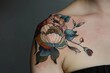 © furyon - vibrant floral tattoo adorning womans shoulder capturing beauty and femininity in colorful ink