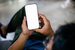© panitan - cell phone blank white screen mockup.hand holding texting using mobile on desk at office.background empty space for advertise.work people contact marketing business,technology