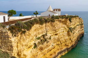 Lagoa, Portugal. 04-18-2024. Beach and cliff near chapel of  Senhora da rocha. Algarve. Portugal.