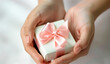 © Edgar Martirosyan - Woman's hands holding a gift box