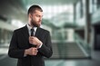 © BillionPhotos.com - Happy proud professional businessman standing in office