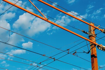 Wall Mural - Image of power lines and wires against a clear blue sky. Suitable for energy or technology concepts