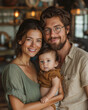 © CreativeIMGIdeas - A family of three, a man, a woman and a baby, are smiling for the camera