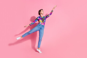 Poster - Full size photo of nice young woman dance arm touch empty space wear pullover isolated on pink color background