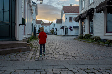 Wall Mural - Family visiting Mandal in Norway, enjoying views, kids playing on sunset