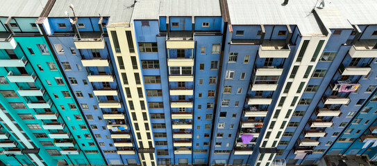 Wall Mural - Aerial view of the facade of a blue residential building.