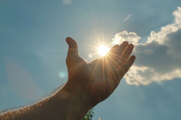 Wall Mural - A Hand Reaching Up To The Sky With The Sun Shining Through It Person Praising and Praying