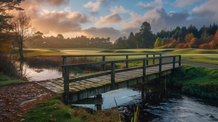 Wall Mural - Wooden bridge over a creek on a golf course at sunrise