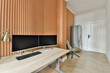 © ADDICTIVE STOCK - Modern home office with sleek furniture and warm tones