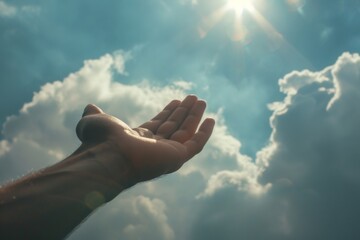Wall Mural - Person Praising and Praying Holding Their Hand Up In The Air With The Sun Shining In The Sky