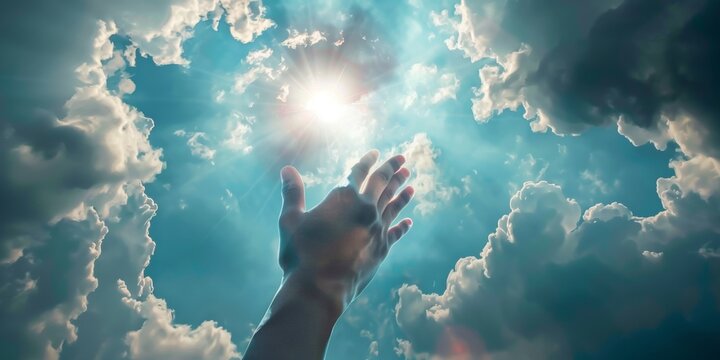 Person Praising and Praying Holding Their Hand Up In The Air With The Sun Shining In The Sky