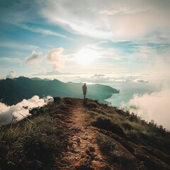 Poster - A person hiking up a mountain trail with a vast sky in the background.