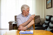 © ADDICTIVE STOCK - Senior man checking blood sugar level at home