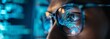 © MOMO - close-up portrait of a man in glasses with reflection of a computer screen with graphs.