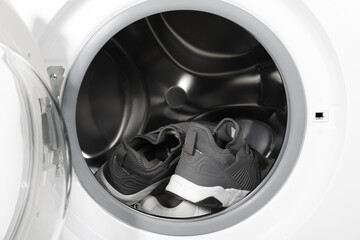 Sticker - Stylish clean sneakers inside modern washing machine