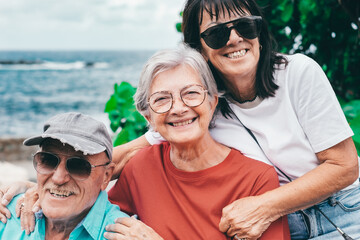 Sticker - Cheerful group of senior friends enjoying sea holidays sitting together looking at camera smiling - travel and vacation, carefree retirement lifestyle concept