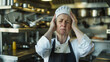 © amila - Desperate and Exhausted Chef with Headache in Restaurant Kitchen | Work Pressure, Tiredness, Sleepless Nights