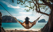 © trompinex - Young female traveler resting in a hammock on a summer beach on vacation.