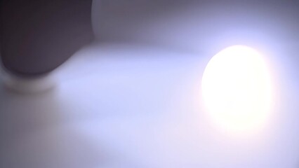 Poster - Illuminated Light Bulb on Dark Background Generative AI