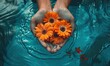 © Olha - man holds orange flowers in blue water in the daylight