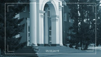 Wall Mural - No people surveillance shot of facade and entrance of classical style historical school or college building with tall white columns, porch, steps, on summer morning