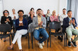 © Mediteraneo - Multiracial group of entrepreneurs attending a seminar in multimedia classroom with smart board.