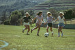 © Dzmitry - Girls Playing Soccer on Field