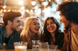 © KirKam - Group of friends laughing and enjoying time together at a cozy cafe, surrounded by warm lights and a joyful atmosphere.