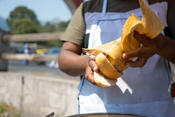 Preparing tamales at a street stall in Mexico City