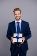 © be free - Corporate present. Mens day. Successful boss share gift box. Businessman prepare for romance date. Business reward. Business man with corporate gift box isolated on grey. Corporate giveaway