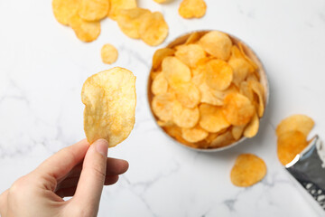 Wall Mural - Potato chips in a bowl on a light background
