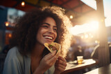 Fototapeta  - Savoring Flavor: Happy Woman Eating Taco