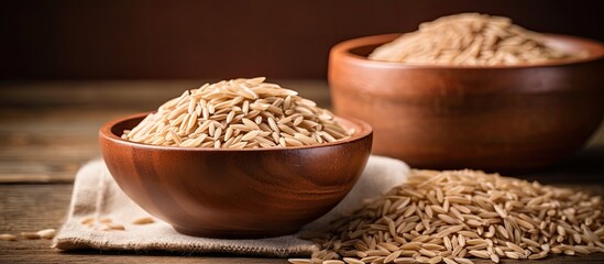 Poster - Copy space image of uncooked brown rice illustrating the concept of healthy food