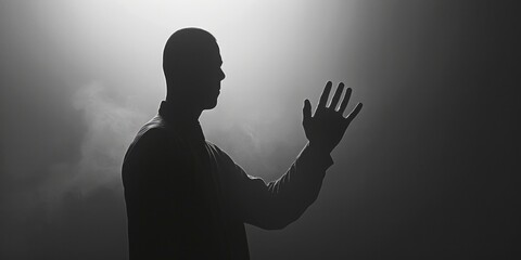 Aufkleber - Silhouette of a man with hand raised, suitable for various concepts