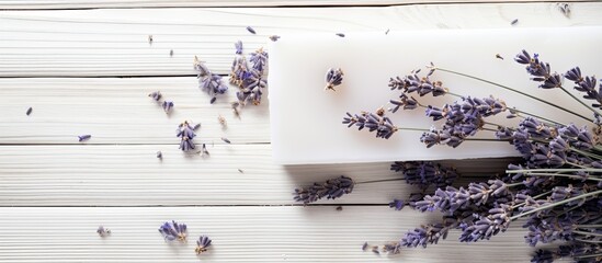 Poster - A copy space image of organic soap adorned with dried lavender flowers set against a white wood backdrop