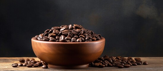 Poster - A wooden bowl holds a composition of coffee beans creating a copy space image