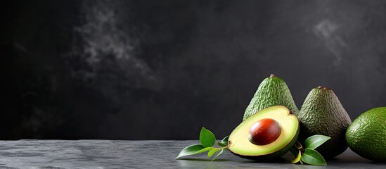 Poster - A copy space image of mature avocados resting on a sleek grey textured surface