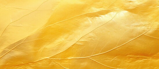 Aufkleber - A background with a shiny yellow leaf gold foil texture resembling a golden paper surface Ideal for copy space image