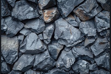 Poster - A pile of black rocks sitting next to each other. Suitable for geological studies