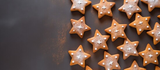 Poster - A top down view of homemade gingerbread cookies shaped like Christmas stars adorned with a creamy cheese filling Copy space image