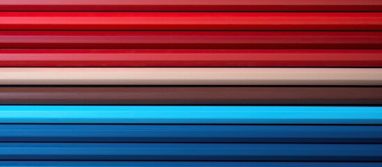 Poster - A copy space image featuring colored paper accompanied by red and blue pencils