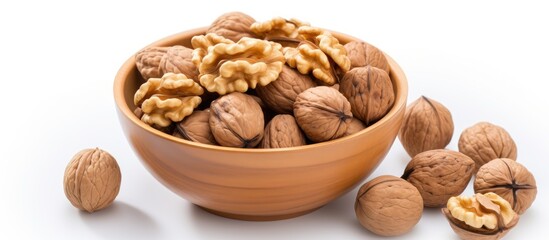 Aufkleber - A top view of a bowl of walnuts isolated on a white background providing copy space for adding text or images to the image