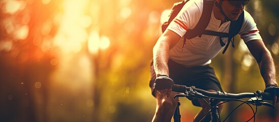 Sticker - Closeup of a male cyclist riding his bicycle outdoors with a copy space image