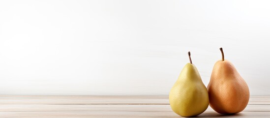 Poster - A single pear is displayed on a white wooden table with a background that offers ample copy space for additional elements