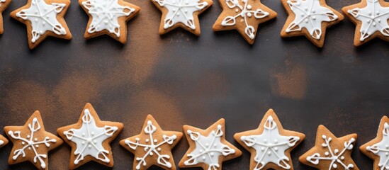 Poster - A top down view of homemade gingerbread cookies shaped like Christmas stars adorned with a creamy cheese filling Copy space image