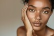 © LukaszDesign - Female portrait with skincare for cosmetics, natural beauty, health, wellbeing, or pride on grey studio background. Makeup, proud woman, organic facial, smooth skin