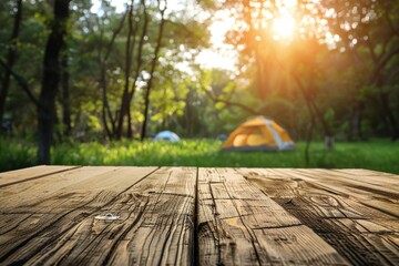 Wall Mural - Wooden table top with blurred camping tent and grass field Fresh and relaxing design for product display or visual layout with copy space