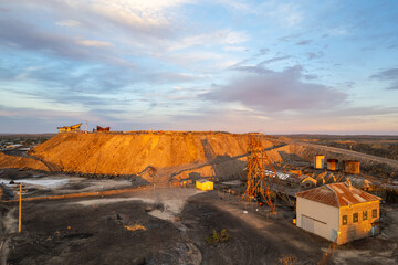 Disused abandoned mine shaft and buildings at Broken Hill's Line of Lode underground mine site at sunset - NSW, Australia